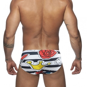 Men's swim briefs with striped patterns and pop art rose crown prints, back view focus