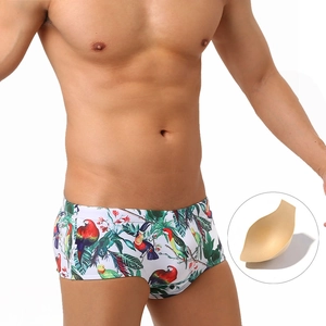 Close-up of men's tropical parrot print swim trunks with removable sponge padding