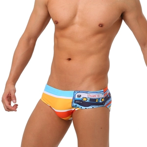 Macro shot of men's colorful striped swim briefs with vintage cassette print details