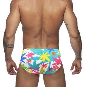 Men's colorful leaf print bikini swim briefs with white base and low-waist cut