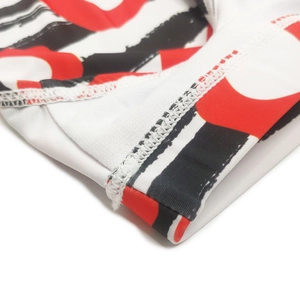 Close-up of high-elasticity fabric with geometric stripe print and double-needle stitching