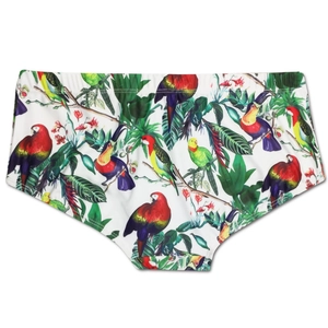 Detailed view of men's square-cut swim trunks with vibrant tropical parrot and floral print