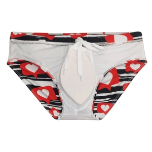 Detail of white striped men's swim briefs with red heart prints and adjustable drawstring