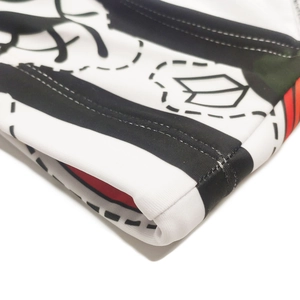 Macro detail of high-quality double-stitch sewing on striped swimwear fabric
