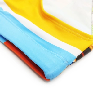 Close-up of vibrant color stitching and high-elastic nylon fabric on retro men's swimwear