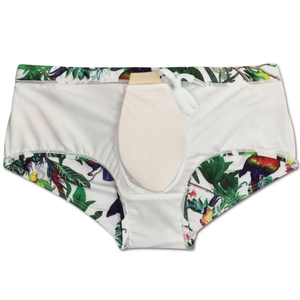 Detail view of tropical bird print swim trunks with protective cup and drawstring waist