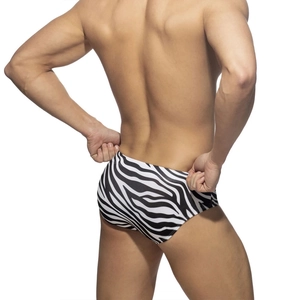 Men's low-rise zebra print swim briefs with a high-cut leg, shown from a back-side view