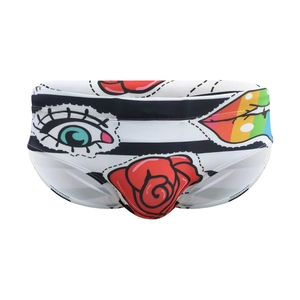 Men's swim briefs with bold pop art lip and rose patterns on black and white stripes