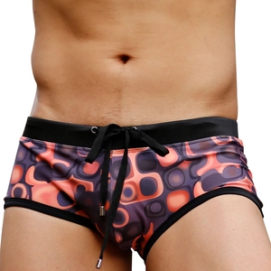 Men's swim trunks with purple and orange abstract geometric print and black drawstring waistband