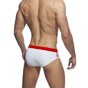 Rear view of men's athletic swim briefs in white with a red elastic waistband and side stripes