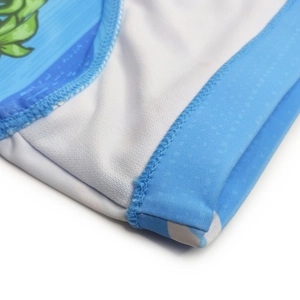 Detail shot of men's blue swimwear fabric featuring polka dot texture and flatlock seams