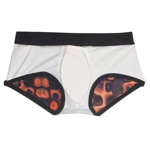 Detail view of men's white swim trunks showing abstract orange lava print lining and trim