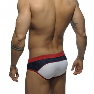 Detail of men's low-rise swim briefs with tricolor patchwork and anchor print