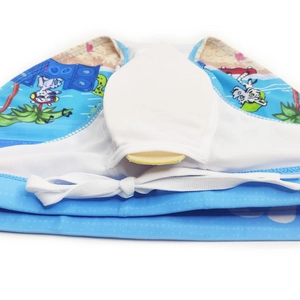 Detail of men's swim briefs with tropical cartoon print, mesh lining and protective cup