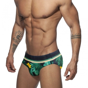 Men's athletic swim briefs featuring a tropical rainforest print and a striped waistband