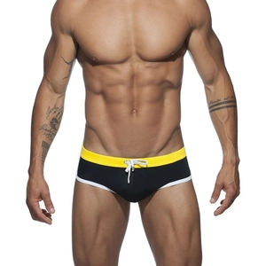 Men's athletic black swim briefs with yellow contrast waistband and drawstring