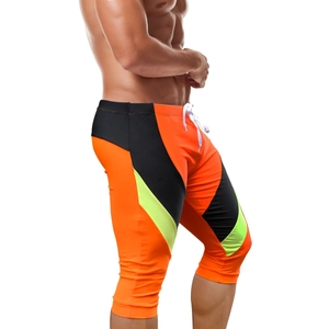 Detail of men's pro athletic compression shorts showing elastic drawstring and color panels