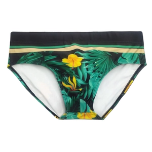 Men's tropical swim briefs with green palm leaves and yellow hibiscus flowers print