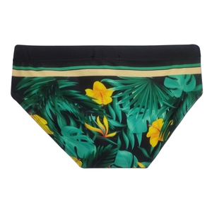 Detail of men's tropical swim briefs featuring green palm leaves and yellow hibiscus flowers