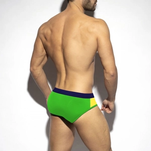 Rear view of men's neon green and navy swim briefs with vibrant yellow side panels
