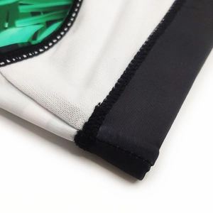 Detailed close-up showing reinforced stitching and vibrant tropical leaf print on swim briefs