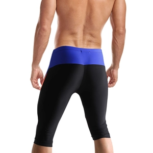 Rear view of men's athletic swimming trunks featuring black blue and orange color block