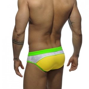 Rear view of men's yellow low-rise swim briefs with neon green waistband and anchor detail