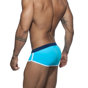 Detail of blue men's swim briefs with navy waistband and white piping trim