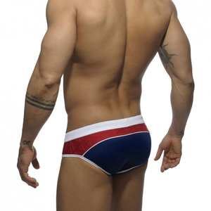 Side view of men's low-rise swim briefs with nautical anchor print and color block design