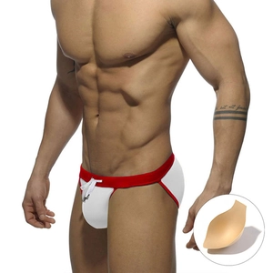 Close-up of men's white high-cut swim briefs with red waist and removable cup padding