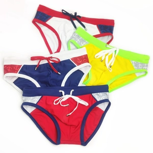 Detail of color-block swim briefs featuring anchor print and drawstring with metal tips
