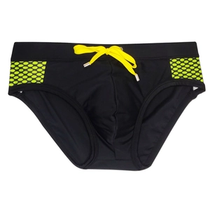 Detail of black swim briefs featuring neon yellow drawstring and honeycomb side print