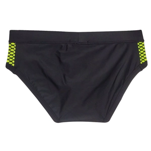 Macro detail of black swim briefs with fluorescent yellow honeycomb print on side panels