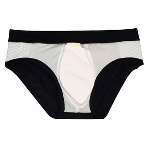 Detail view of men's athletic swimwear with color block design and honeycomb texture panels