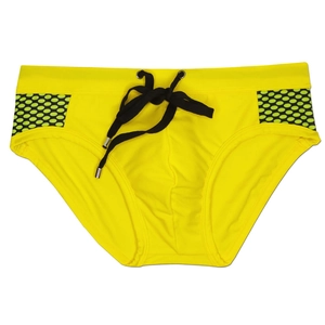Detail of yellow swim briefs featuring polka dot mesh side panels and drawstring