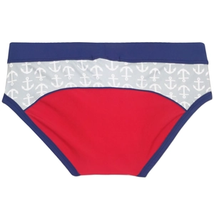 Detail of color-block swim briefs featuring nautical anchor patterns and elastic waistband