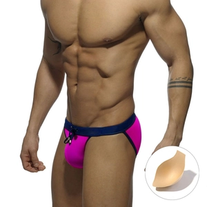 Men's sexy rose pink low-rise swim briefs with blue contrast trim and cup padding