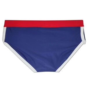 Detail of ergonomic men's swim briefs with red waist and navy blue contrast panels