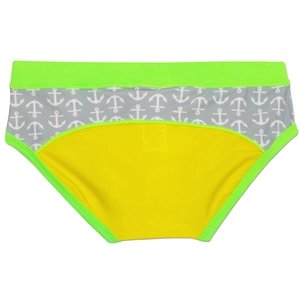 Detail of color-block swim briefs with neon green trim and nautical anchor pattern