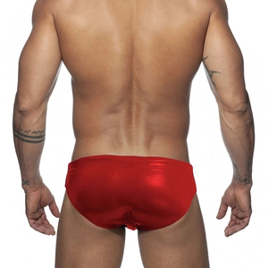 Macro detail of men's low waist swim briefs with red metallic shiny finish fabric