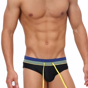 Detail view of men's black swim briefs with colorful layered waistband and yellow drawstring