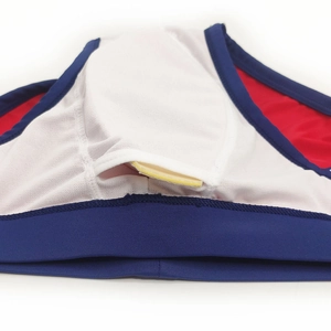 Detail of men's swim briefs showing double-layer pocket with yellow removable pad