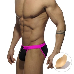 Men's sexy high-cut black swim briefs with pink trim and a removable contour pad