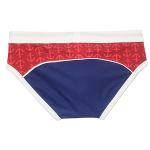 Detail of men's swim briefs with red anchor pattern, navy panels, and white elastic trim
