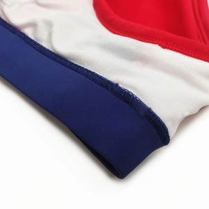 Detail of color-block swim briefs showing high-elastic fabric and precise stitching