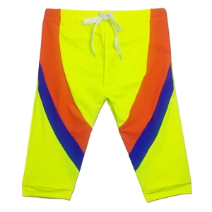 Detail of drawstring waistband and contrast V-stripe on neon swimming shorts