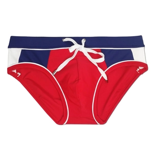 Detail of red men's swim briefs with navy color block and adjustable white drawstring