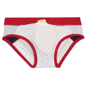 Macro detail of men's color-block swim briefs with built-in protective cup and red waistband