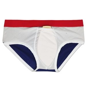 Detail of men's tricolor swim briefs featuring white mesh fabric and a red waistband