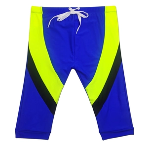 Flat lay of blue swim trunks showing waist drawstring and side contrast stitching details